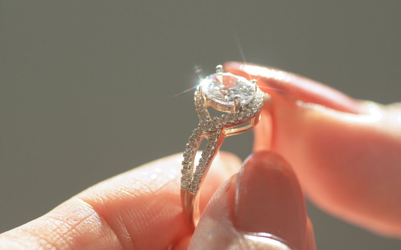 close-up-view-of-a-diamond-ring-and-woman-hand-2023-11-27-05-09-01-utc